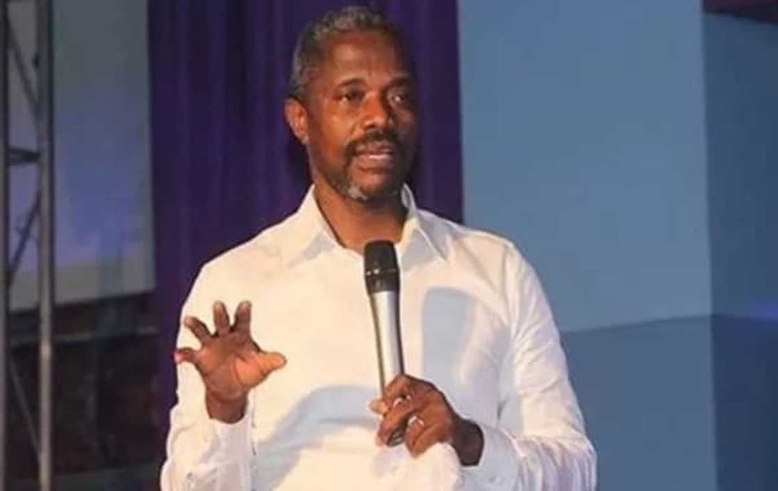 A man holding a microphone A man holding a microphone