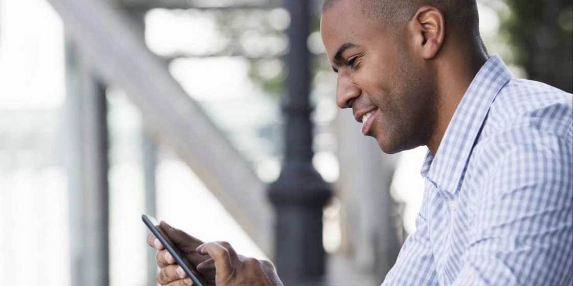 african man texting african man texting