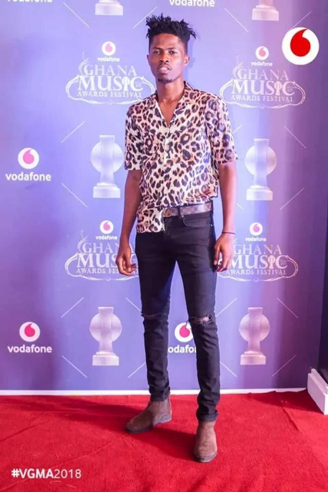 A man with a shirt partly tucked in A man with a shirt partly tucked in