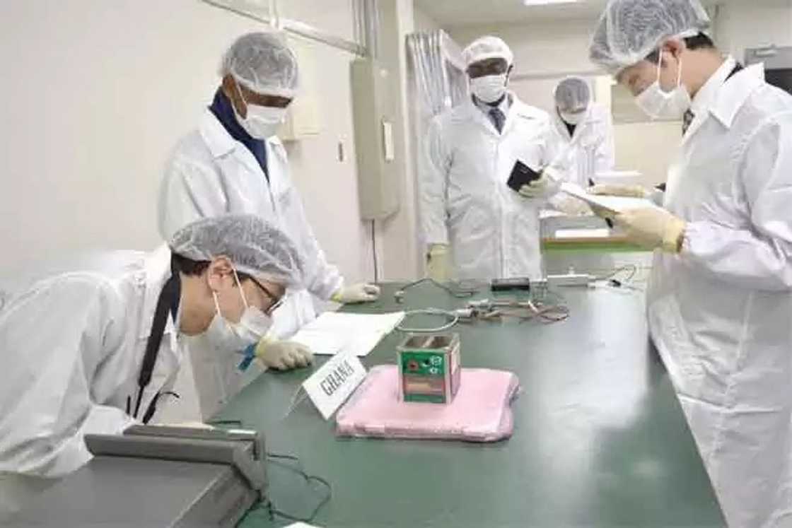JAXA safety team inspecting the flight model of GHANASAT. Looking on is Dr Donkor (3rd left), President of All Nations University College. JAXA safety team inspecting the flight model of GHANASAT. Looking on is Dr Donkor (3rd left), President of All Nations University College.