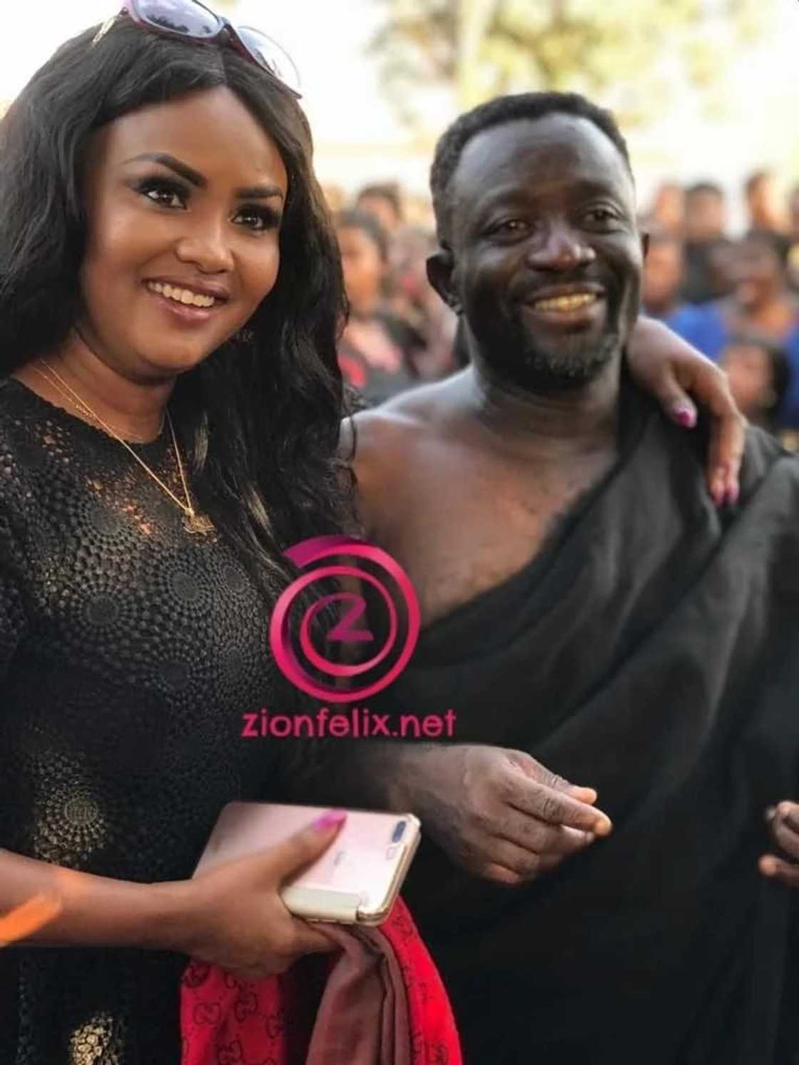 Nana Ama Mcbrown and Samuel Nyamekye clad in funeral clothing and smile for a photo