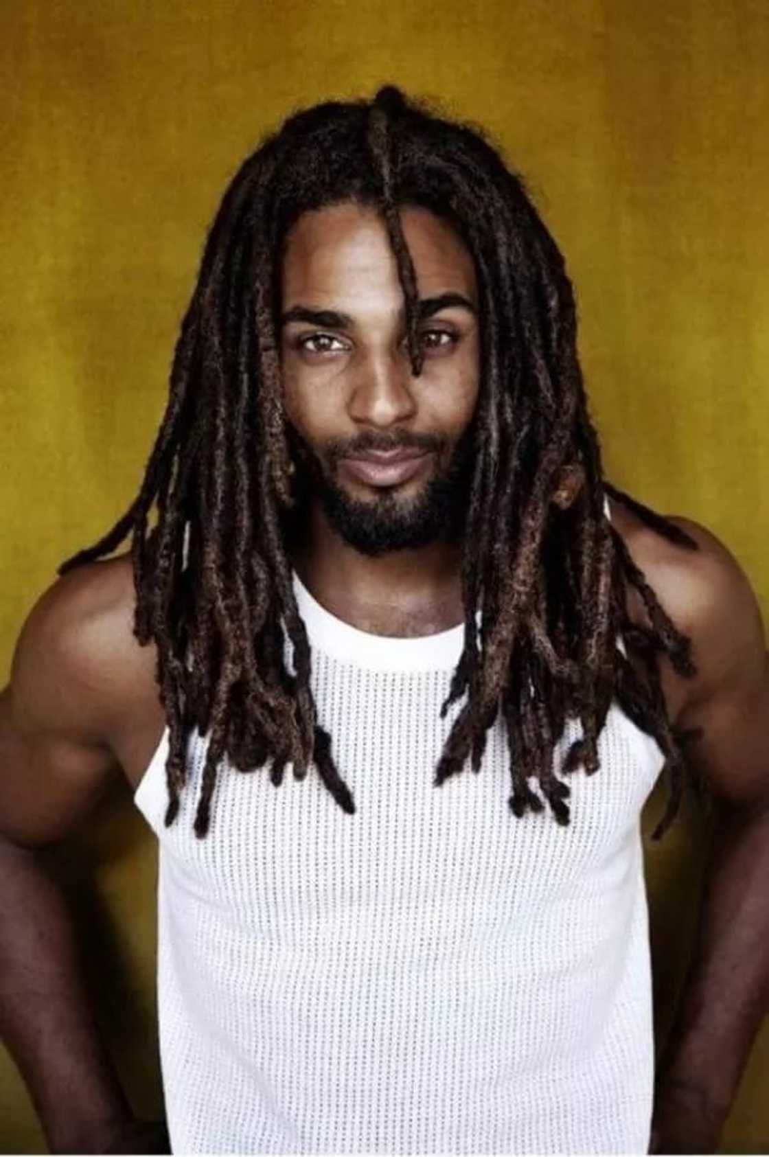 A man wearing dreadlocks A man wearing dreadlocks