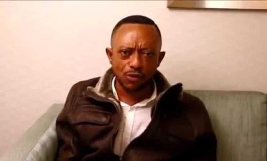 A man seated in a chair A man seated in a chair