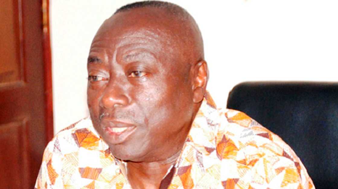 A man seated in a chair A man seated in a chair