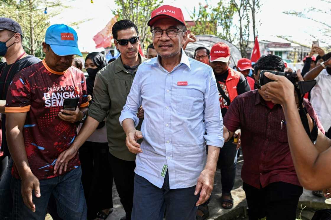Anwar Ibrahim (C) is once again leading his party into elections with hopes of earning Malaysia's top job Anwar Ibrahim (C) is once again leading his party into elections with hopes of earning Malaysia's top job