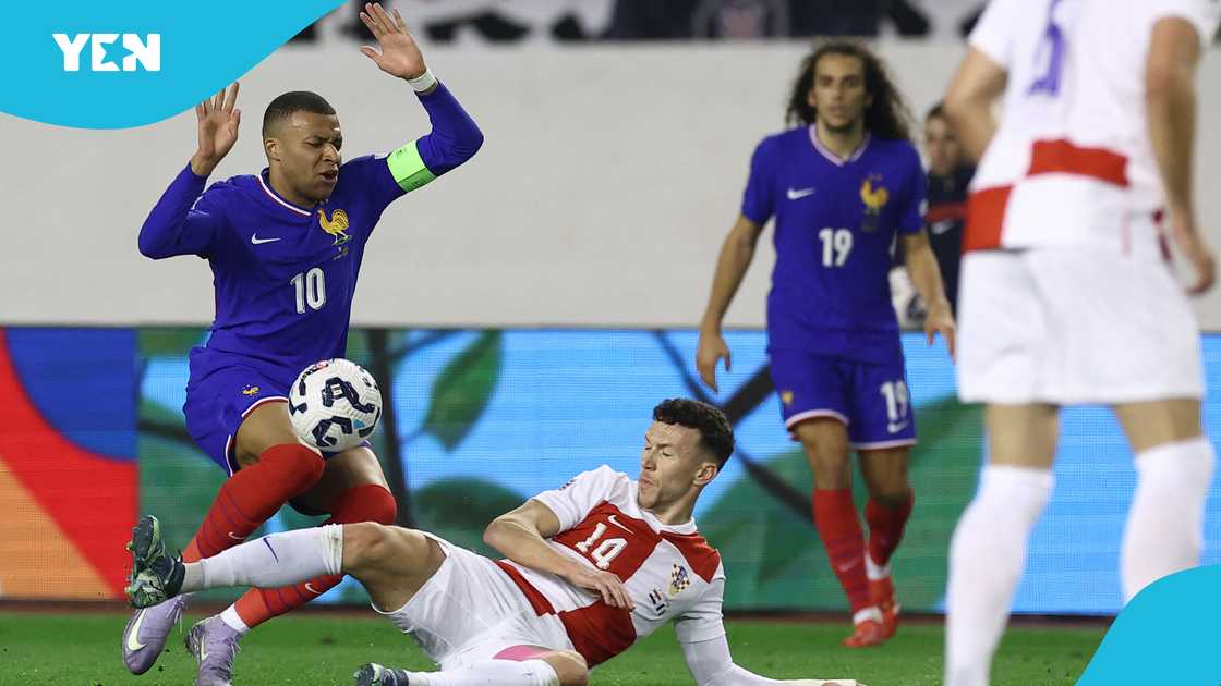 Kylian Mbappe (L) fights for the ball with Croatia's forward Ivan Perisic (C) during the UEFA Nations League quarter-final first-leg football match between Croatia and France at the Poljud Stadium in Split, on March 20, 2025 Kylian Mbappe (L) fights for the ball with Croatia's forward Ivan Perisic (C) during the UEFA Nations League quarter-final first-leg football match between Croatia and France at the Poljud Stadium in Split, on March 20, 2025