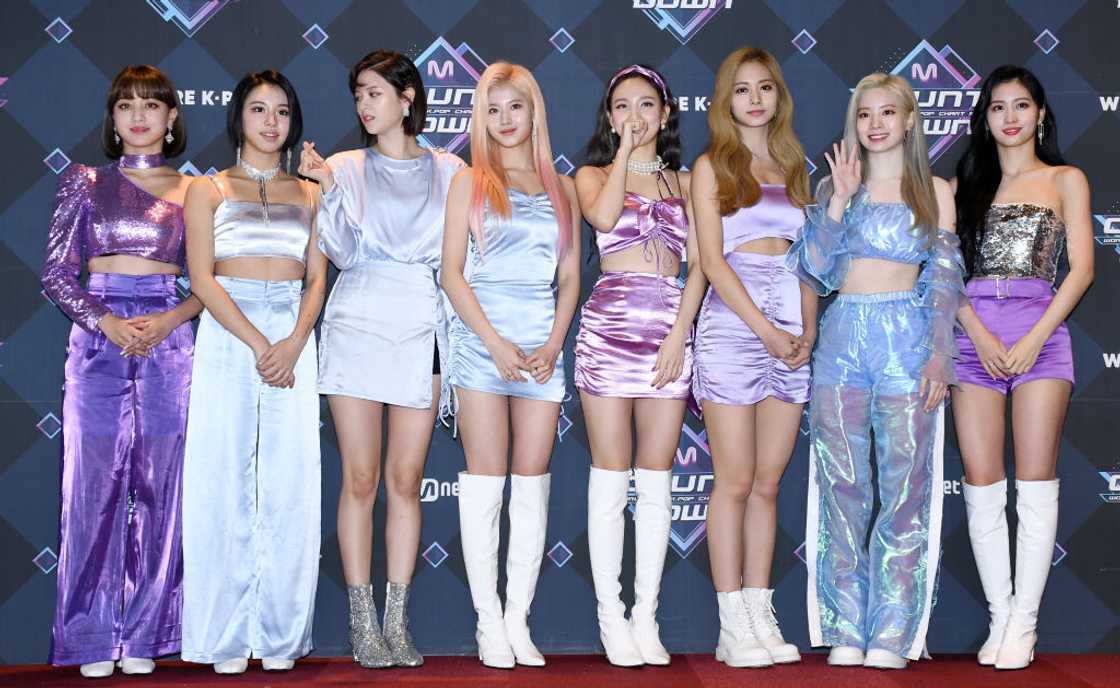 TWICE, one of the most popular K-pop groups in the world, pose for a photo in silk outfits TWICE, one of the most popular K-pop groups in the world, pose for a photo in silk outfits