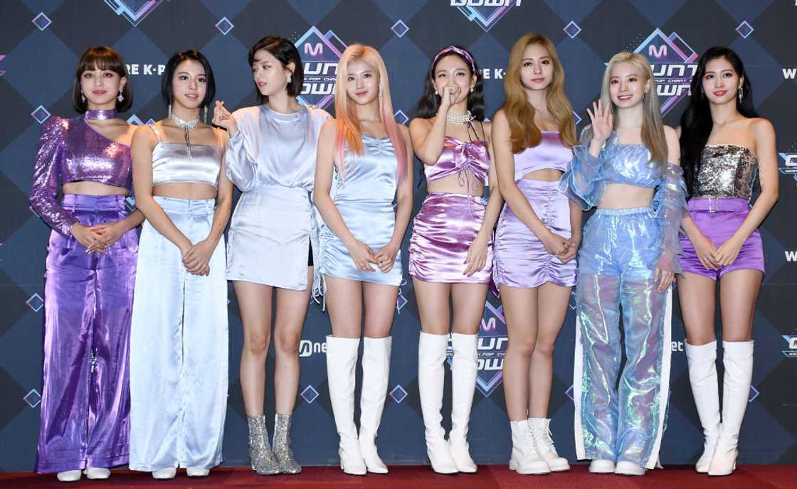 TWICE, one of the most popular K-pop groups in the world, pose for a photo in silk outfits