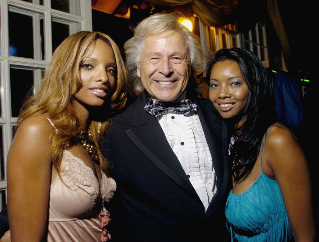 Peter Nygard, seen during his jet-setting days, with two women attending the Toronto International Film Festival opening party in September 2005