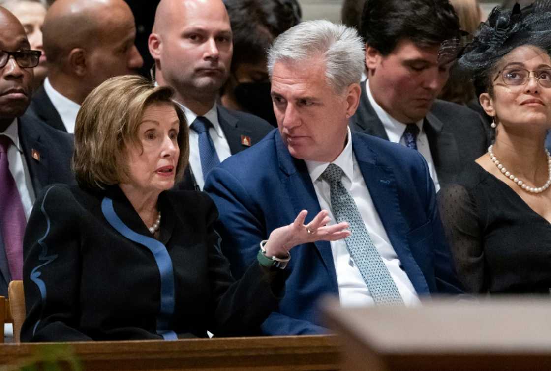 House Speaker Nancy Pelosi speaks to Republican leader Kevin McCarthy at a memorial service for Queen Elizabeth II on September 21, 2022