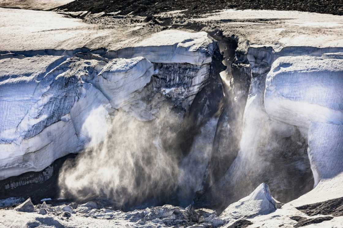 In this file photo taken on July 17, 2022, meltwater flows from the Greenland ice sheet into the Baffin Bay near Pituffik, Greenland In this file photo taken on July 17, 2022, meltwater flows from the Greenland ice sheet into the Baffin Bay near Pituffik, Greenland