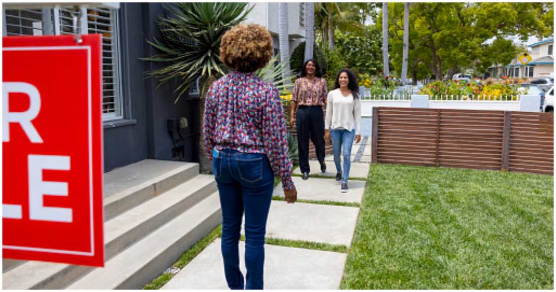 A family meets with a property seller