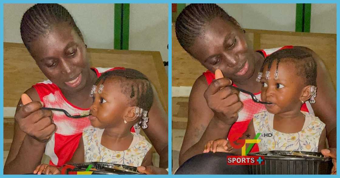 Gambian athletes feeds daughter after playing in All African Games Gambian athletes feeds daughter after playing in All African Games