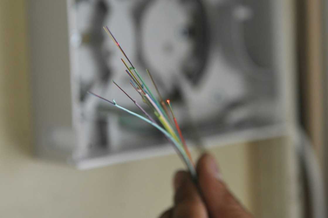 BT said the cut in staff numbers was in part due to the completion of the roll out of its fibre optic broadband internet network BT said the cut in staff numbers was in part due to the completion of the roll out of its fibre optic broadband internet network