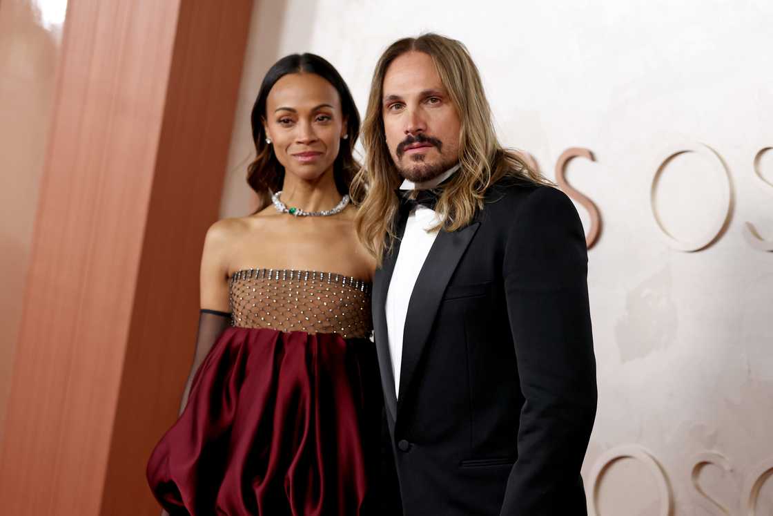 Zoë and Marco Perego arrive at the 97th Annual Oscars. Zoë and Marco Perego arrive at the 97th Annual Oscars.