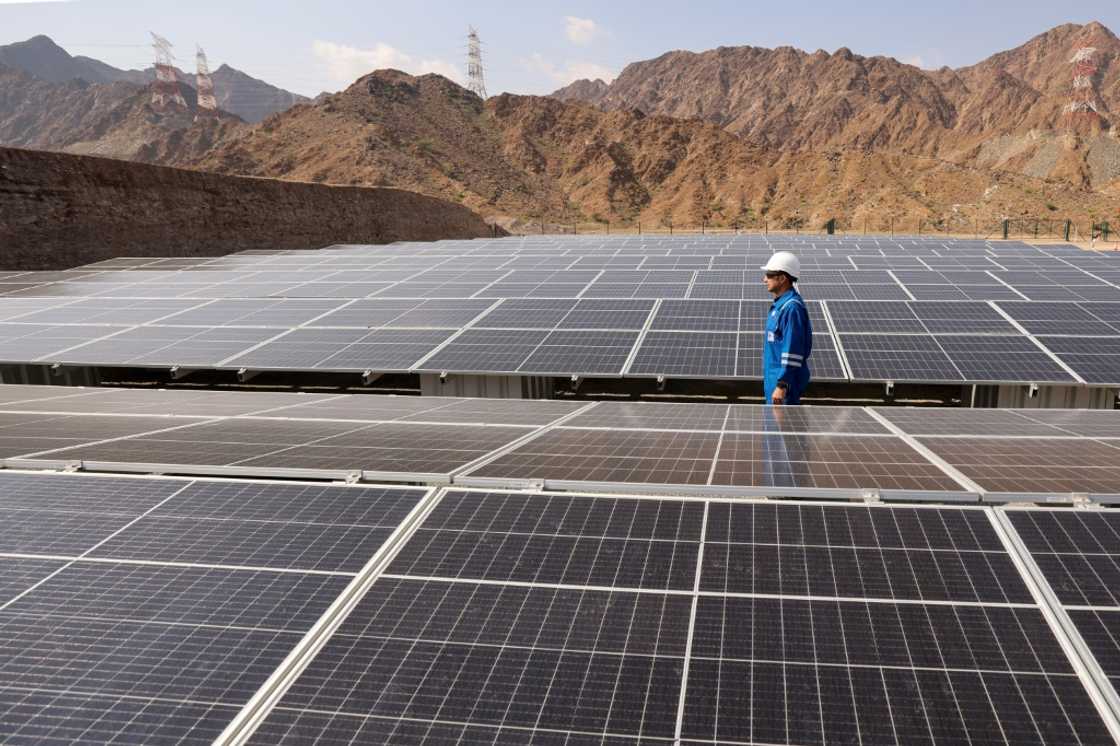 An engineer checks solar panels at the ADNOC carbon capture facility in the UAE An engineer checks solar panels at the ADNOC carbon capture facility in the UAE