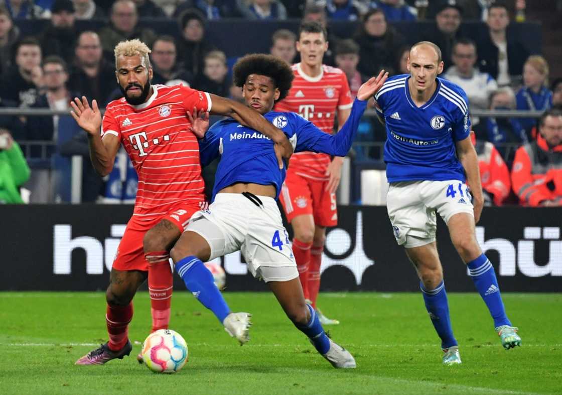Bayern Munich forward Eric Maxim Choupo-Moting (L) battles for possession in a Bundesliga match against Schalke 04. Bayern Munich forward Eric Maxim Choupo-Moting (L) battles for possession in a Bundesliga match against Schalke 04.