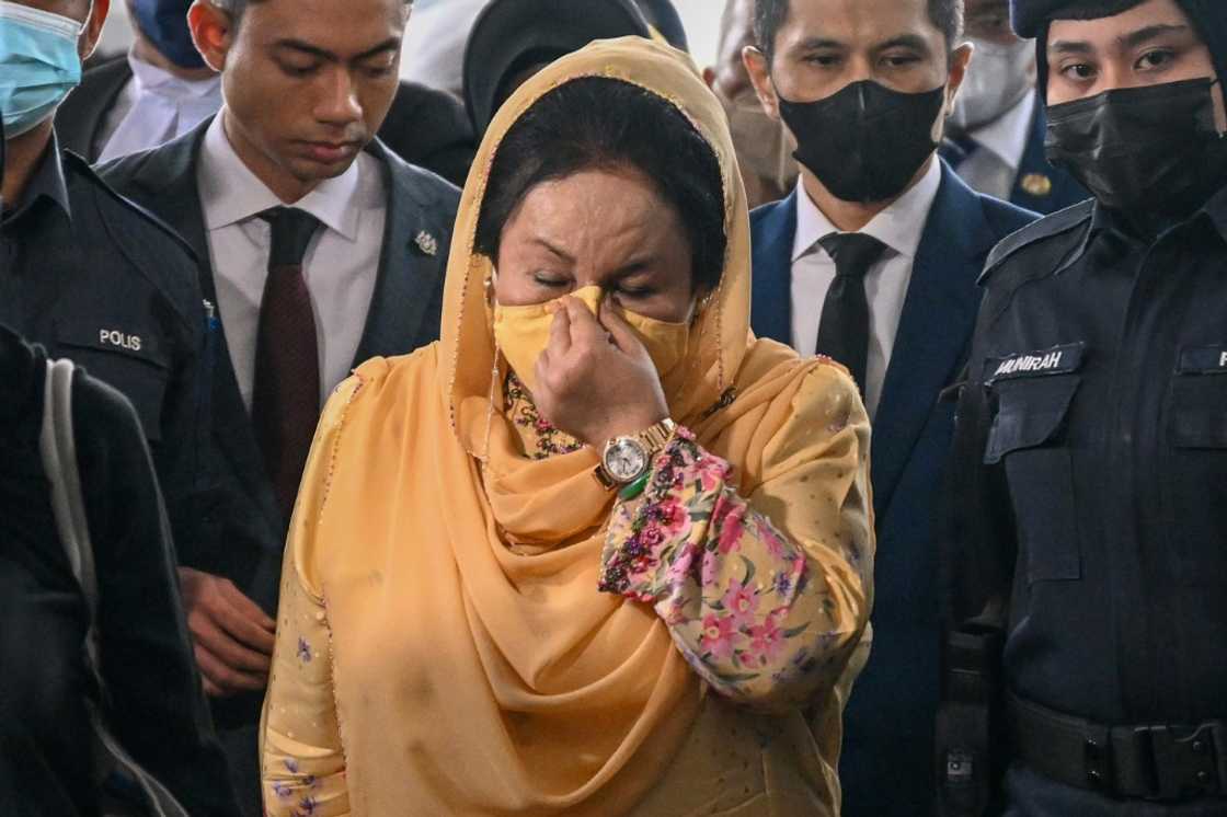 Rosmah Mansor (C), the wife of jailed former Malaysian PM Najib Razak, has been found guilty of corruption Rosmah Mansor (C), the wife of jailed former Malaysian PM Najib Razak, has been found guilty of corruption