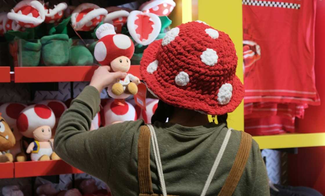 A guest looks at a Toad toy in a store during a preview of Super Nintendo World in Los Angeles A guest looks at a Toad toy in a store during a preview of Super Nintendo World in Los Angeles