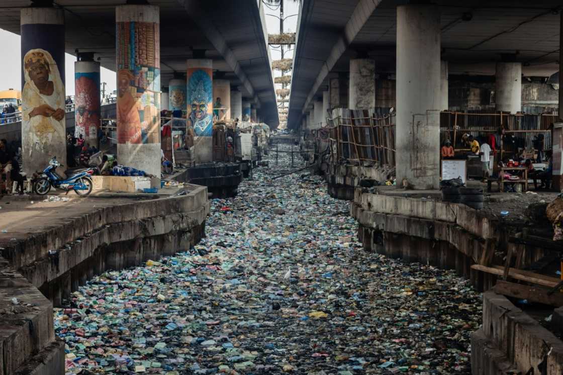 Some of the waterways and canals in Lagos are already clogged with plastic waste Some of the waterways and canals in Lagos are already clogged with plastic waste