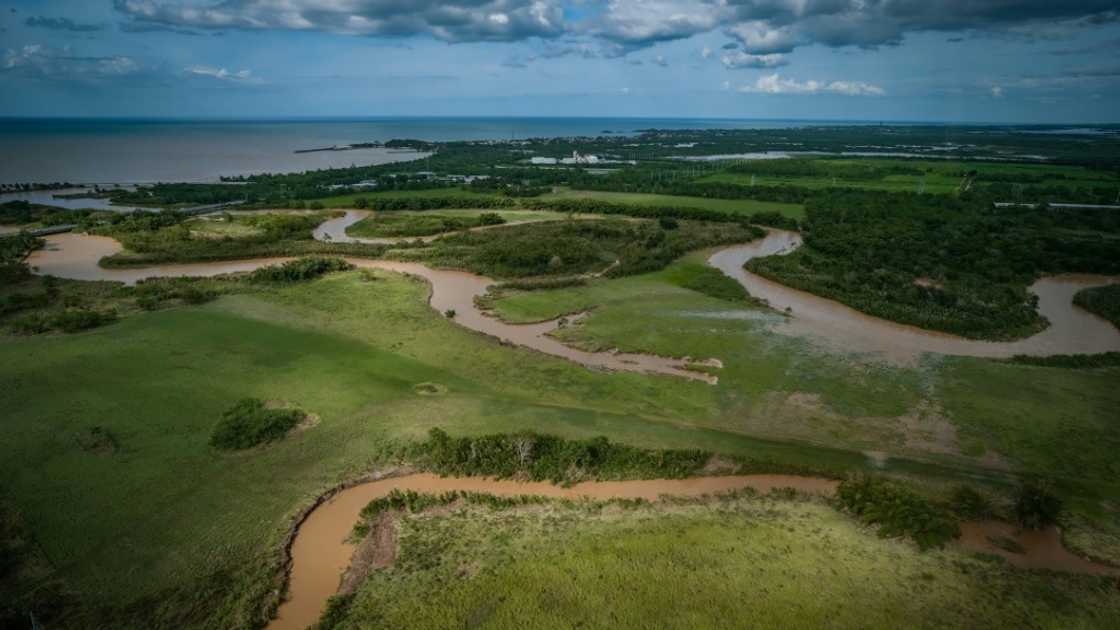 This aerial picture shows a flooded area in Arecibo, Puerto Rico, after the passage of Hurricane Fiona This aerial picture shows a flooded area in Arecibo, Puerto Rico, after the passage of Hurricane Fiona