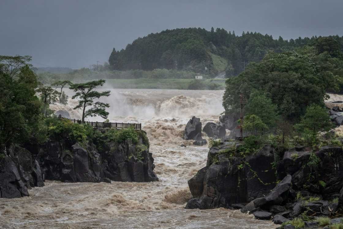 Heavy rainfall has left rivers in southwestern Japan swollen and authorities have warned flooding remains possible Heavy rainfall has left rivers in southwestern Japan swollen and authorities have warned flooding remains possible