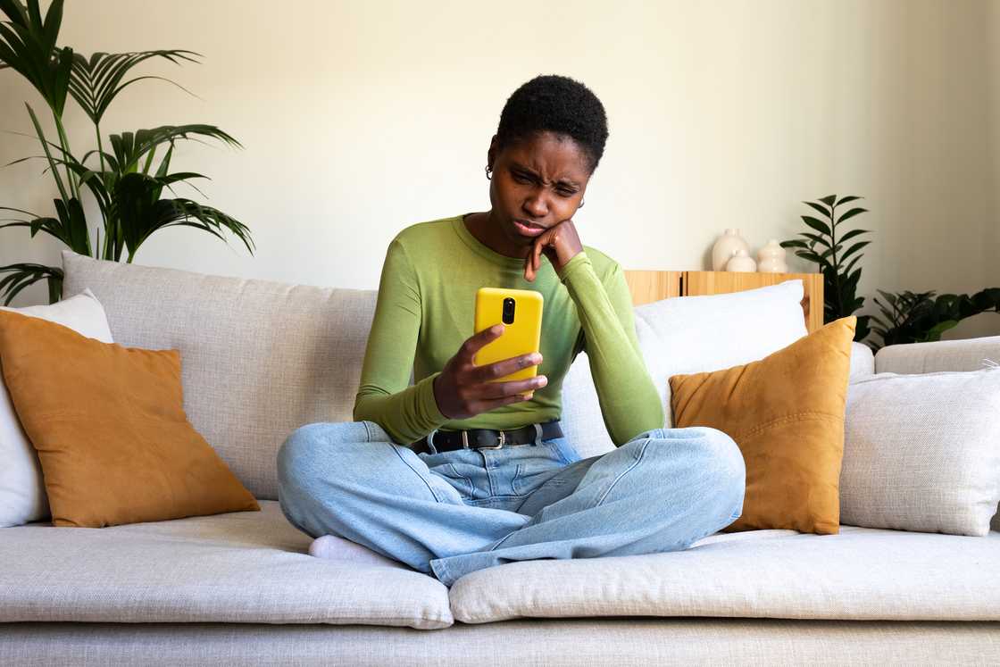 A woman looking at her phone