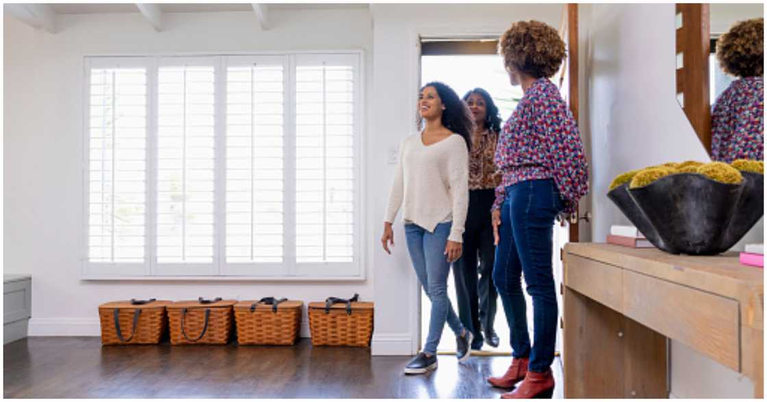 Real estate agent brings people for property viewing