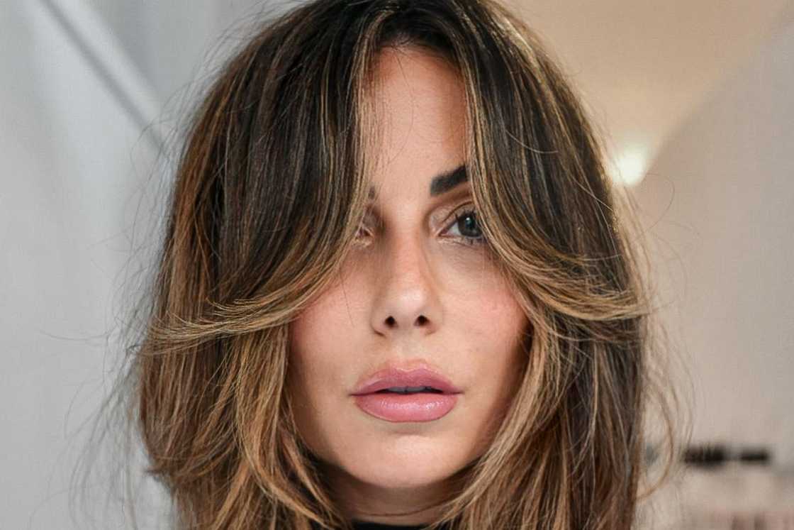 Layered midlength haircut + curtain fringe with soft golden highlights Layered midlength haircut + curtain fringe with soft golden highlights