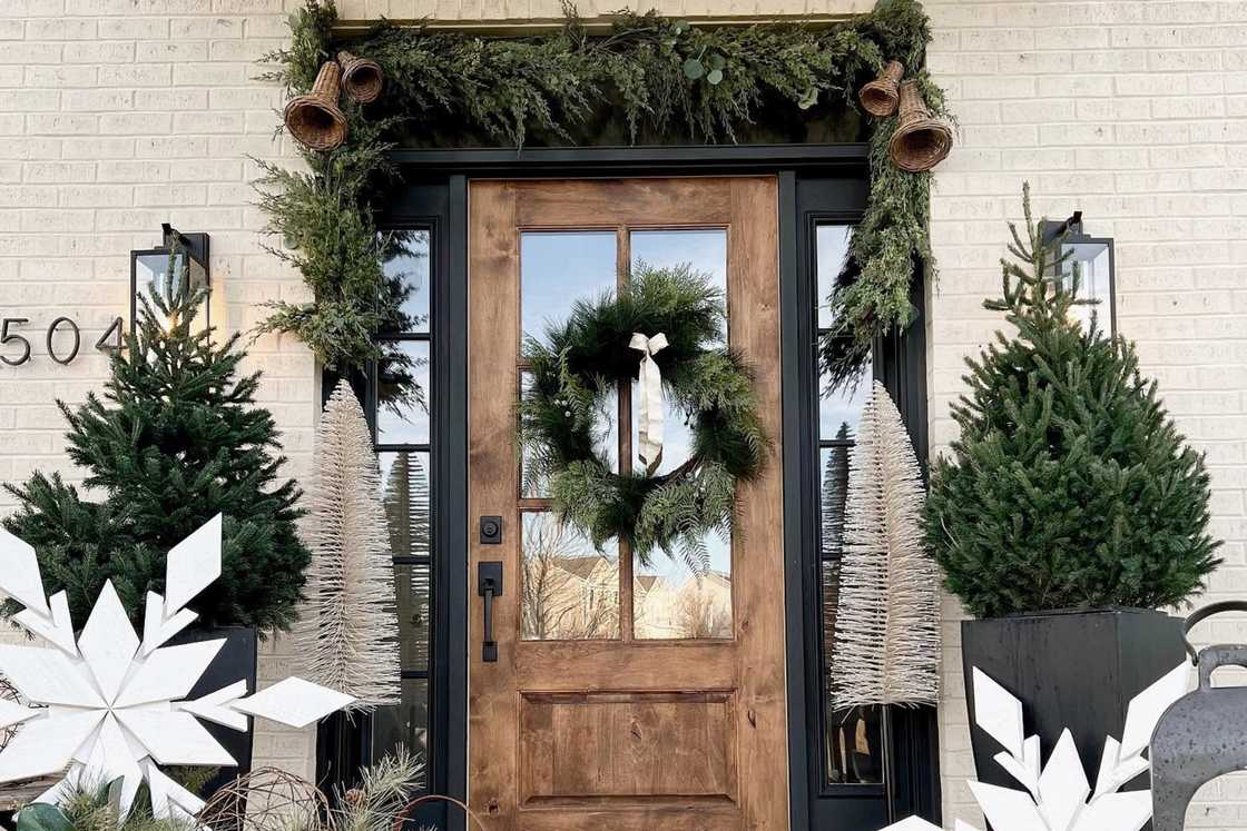 Christmas/winter front porch with fresh greens and snowflakes