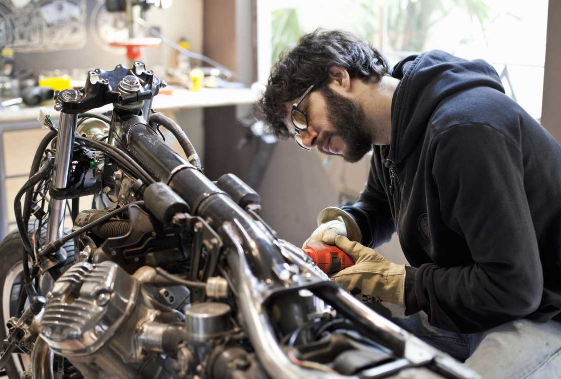 A mechanic in a garage A mechanic in a garage