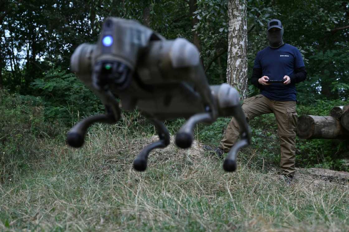 A robot dog leaps into the air, controlled by its operator in Ukraine