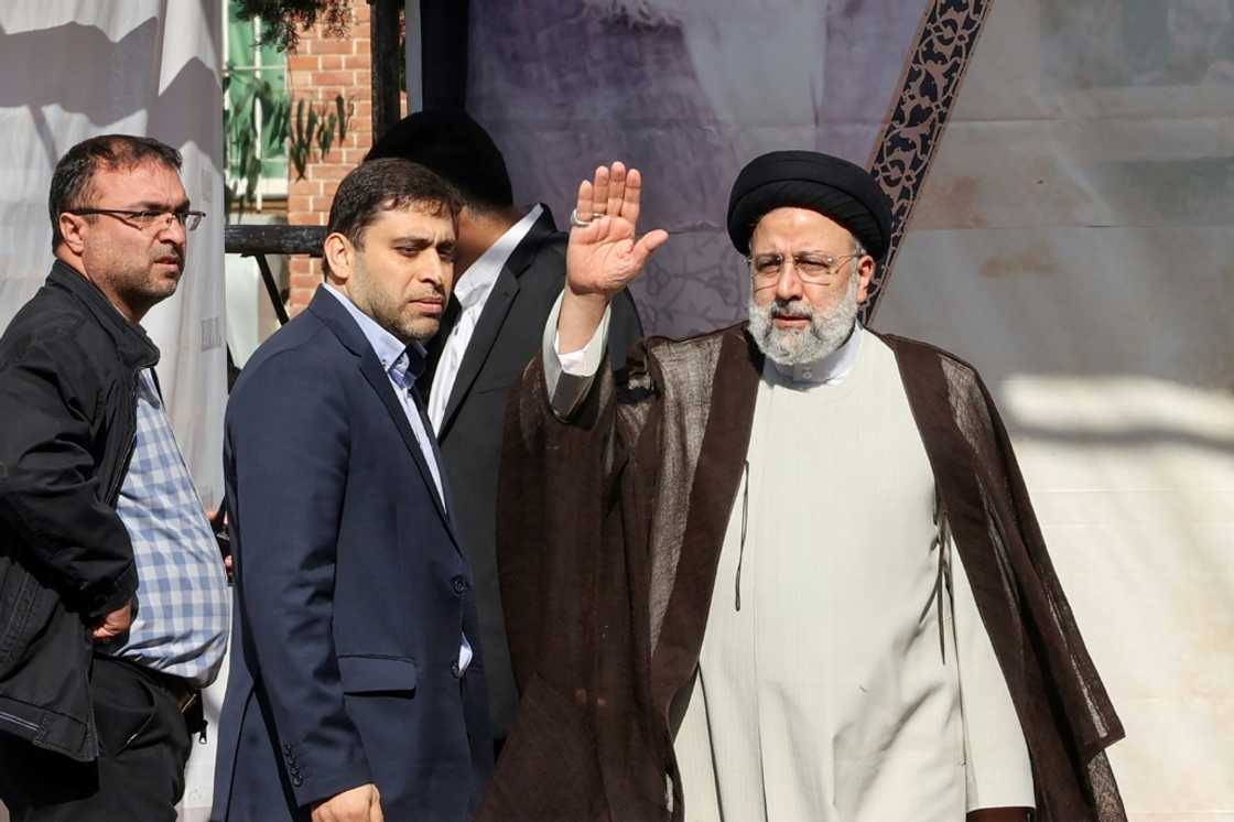 Iran's President Ebrahim Raisi waves as he arrives for a speech at a rally outside the former US embassy in the capital Tehran on November 4, 2022, to mark the 43th anniversary of the start of the Iran hostage crisis Iran's President Ebrahim Raisi waves as he arrives for a speech at a rally outside the former US embassy in the capital Tehran on November 4, 2022, to mark the 43th anniversary of the start of the Iran hostage crisis