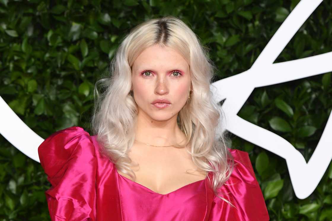 Anja Konstantinova is standing near a green-and-white background in London, England Anja Konstantinova is standing near a green-and-white background in London, England