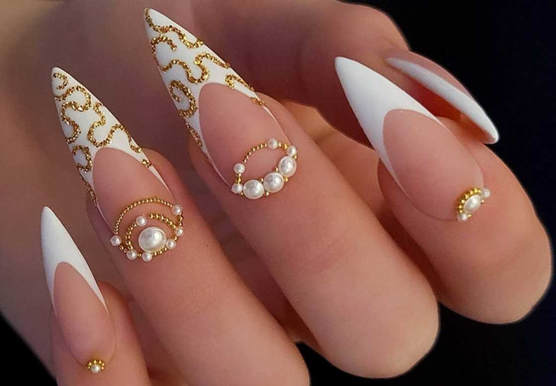 Stiletto milky nails with rhinestones