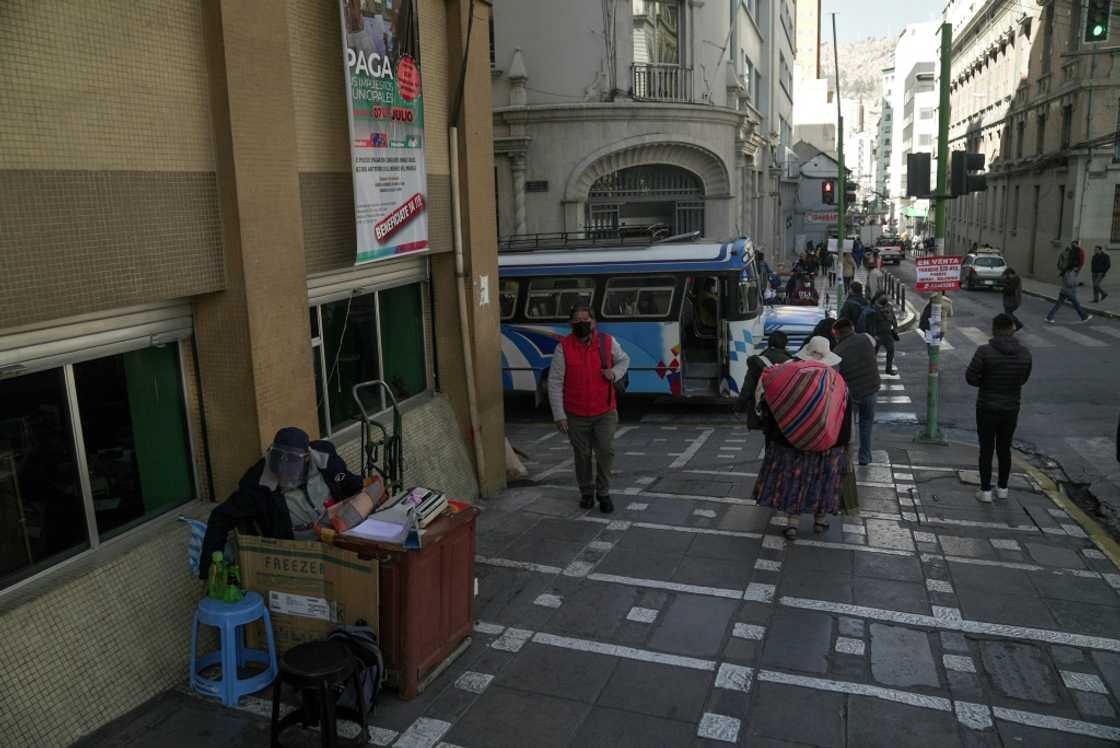 Rogelio Condori recently set up an office complete with internet and a computer, but he much prefers his 'exciting' sidewalk perch Rogelio Condori recently set up an office complete with internet and a computer, but he much prefers his 'exciting' sidewalk perch