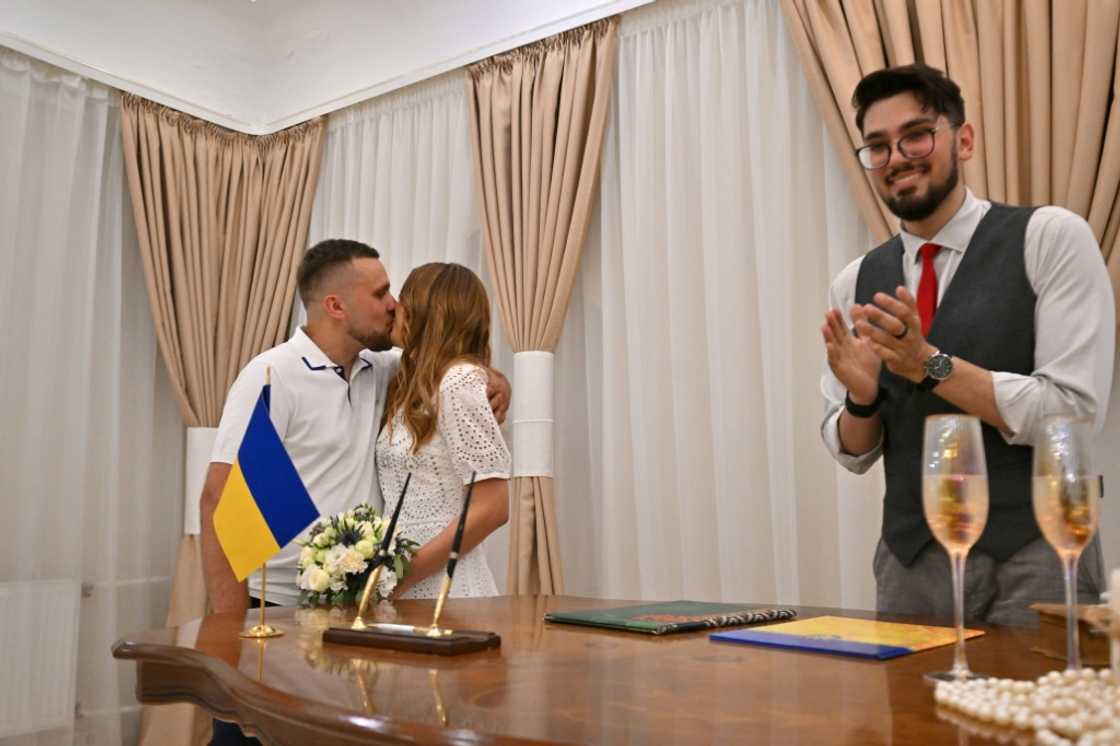Vitaliy Charnykh has been conducting back-to-back ceremonies at a registry office in Kyiv as couples dash to marry amid the uncertainty of war Vitaliy Charnykh has been conducting back-to-back ceremonies at a registry office in Kyiv as couples dash to marry amid the uncertainty of war