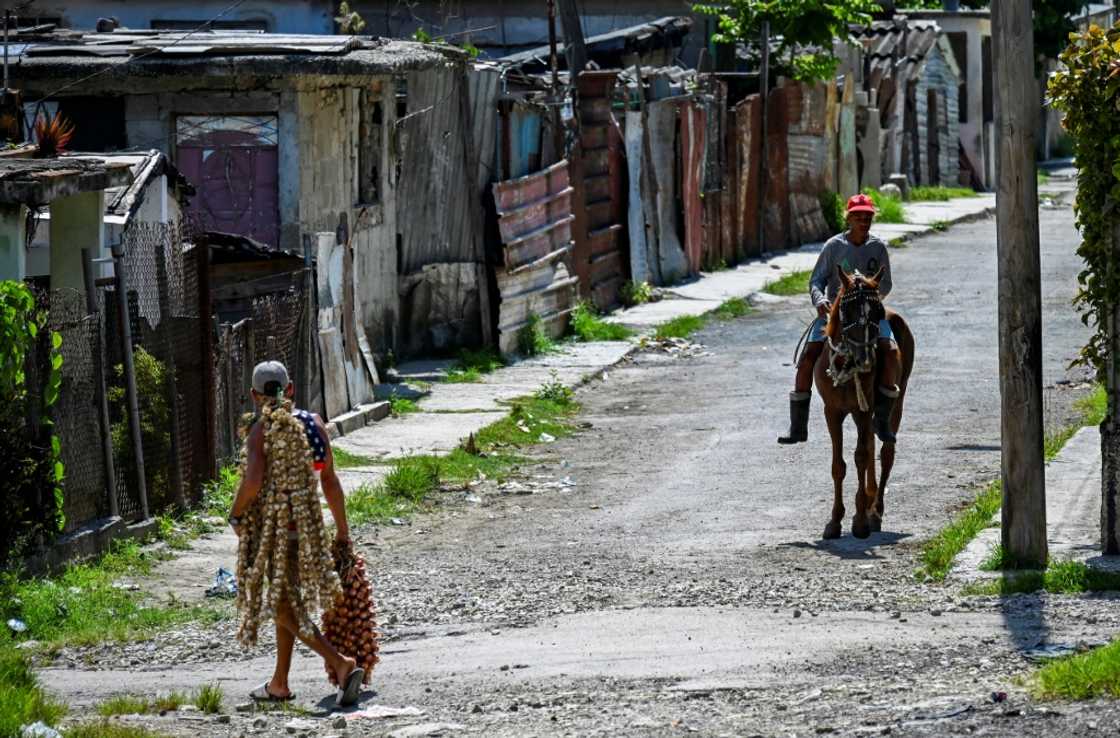 A street in the neighborhood of La Guinera on the outskirts of Havana is seen in June 2022 A street in the neighborhood of La Guinera on the outskirts of Havana is seen in June 2022