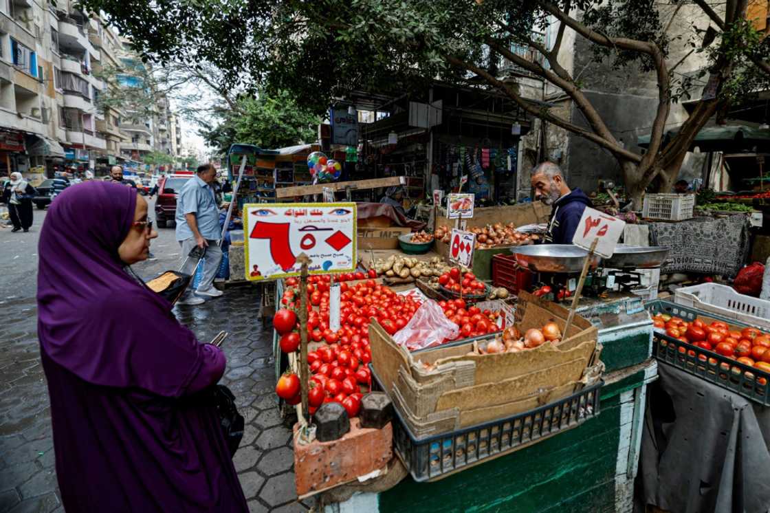 A roadside vegetable market in Cairo -- as Egypt implements IMF economic reforms, middle class purchasing power is eroding A roadside vegetable market in Cairo -- as Egypt implements IMF economic reforms, middle class purchasing power is eroding