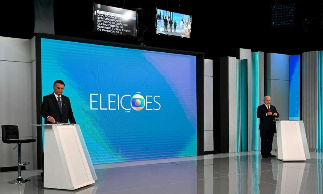 Brazilian President Jair Bolsonaro (L) and former president Luiz Inacio Lula da Silva (R) get ready for televised debates ahead of Sunday's tense presidential runoff Brazilian President Jair Bolsonaro (L) and former president Luiz Inacio Lula da Silva (R) get ready for televised debates ahead of Sunday's tense presidential runoff