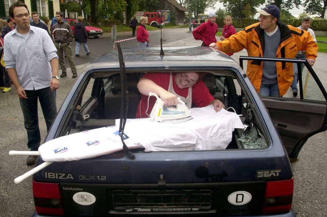 Claire Agnew irons a shirt during the urban section of the Extreme Ironing World Championships in Germany.