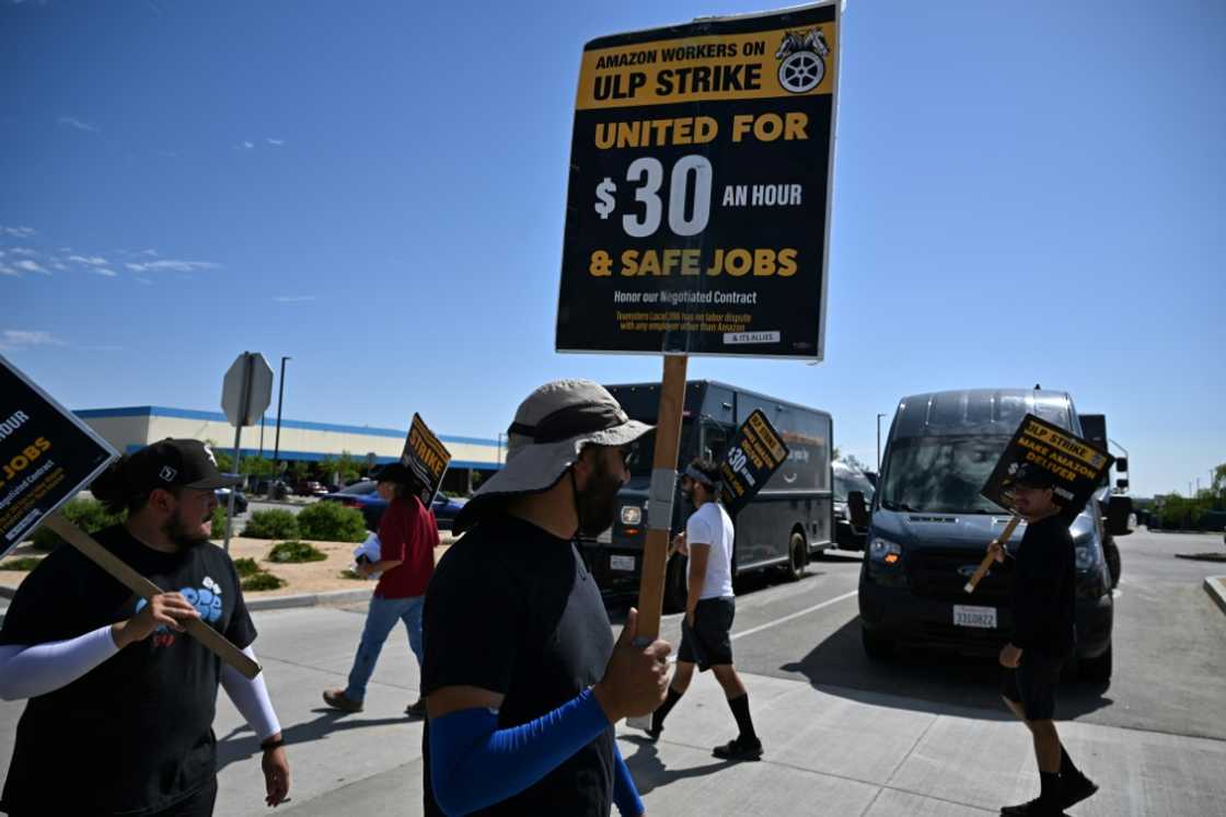 Drivers for contracted companies drive Amazon-branded vans under work conditions largely set by Amazon, but aren't considered employees of the online retail giant Drivers for contracted companies drive Amazon-branded vans under work conditions largely set by Amazon, but aren't considered employees of the online retail giant