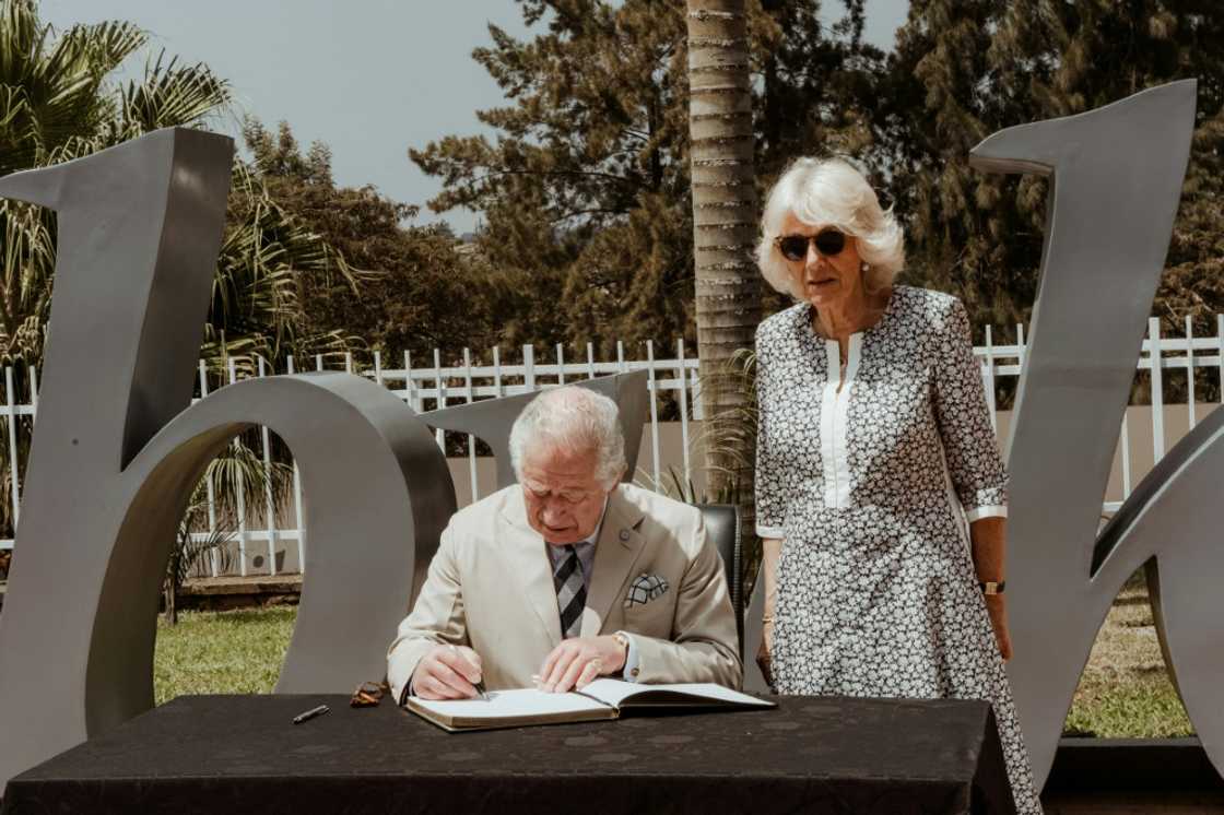 Britain's Prince Charles, accompanied by his wife Camilla, signed a note of remembrance at the Kigali Genocide Memorial Britain's Prince Charles, accompanied by his wife Camilla, signed a note of remembrance at the Kigali Genocide Memorial