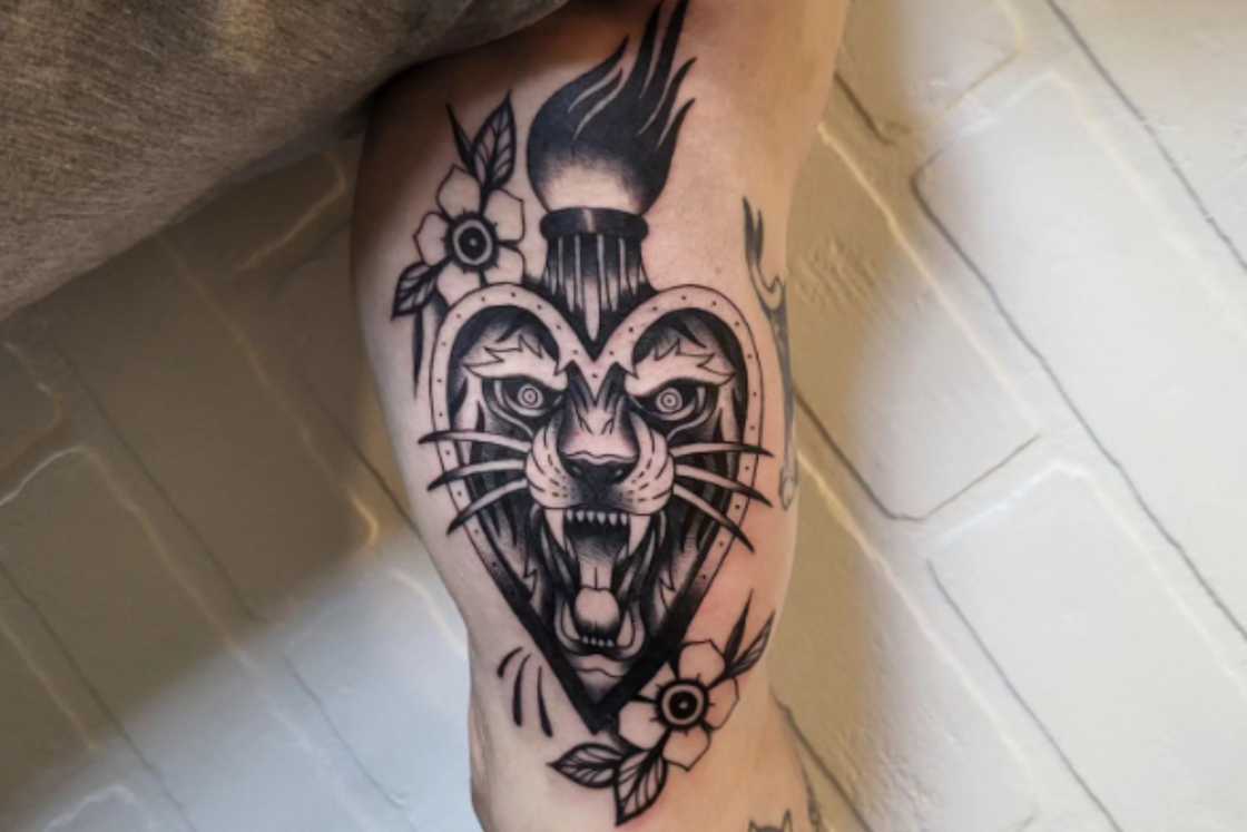 Super fun tiger head sacred heart tattoo