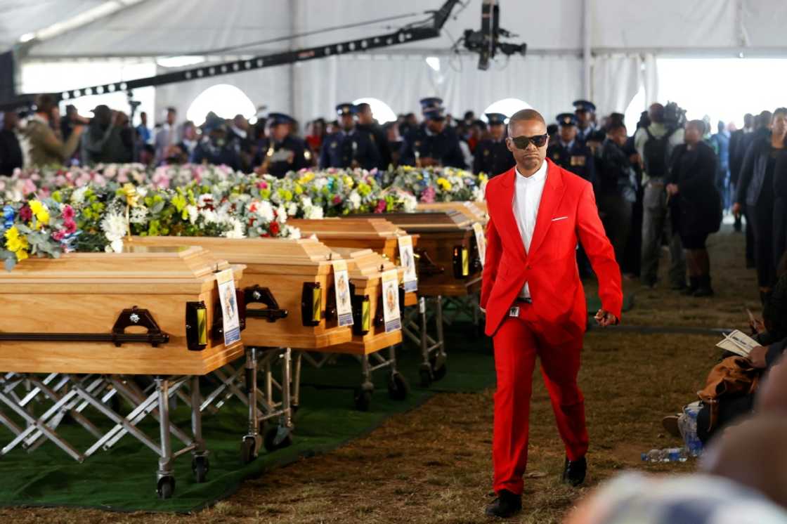 Empty coffins were placed at the memorial service to symbolise the loss