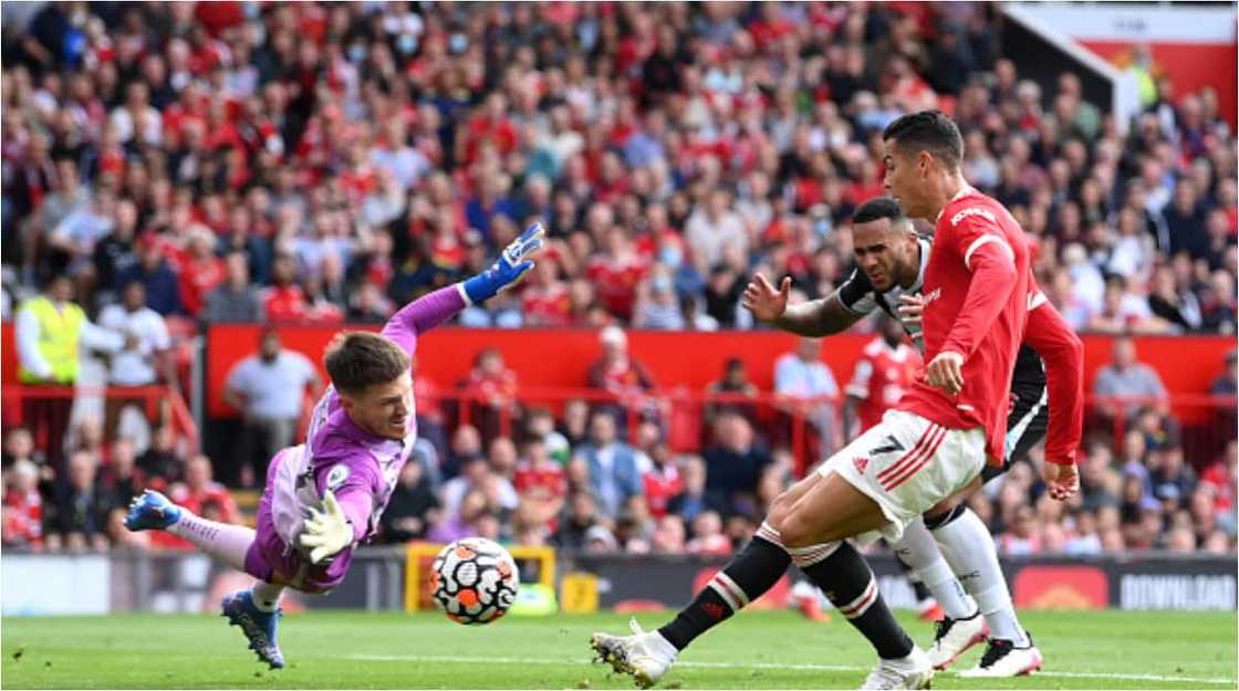 Burna Boy storms Old Trafford with his mom to support Pogba, celebrates in style after Ronaldo's brace