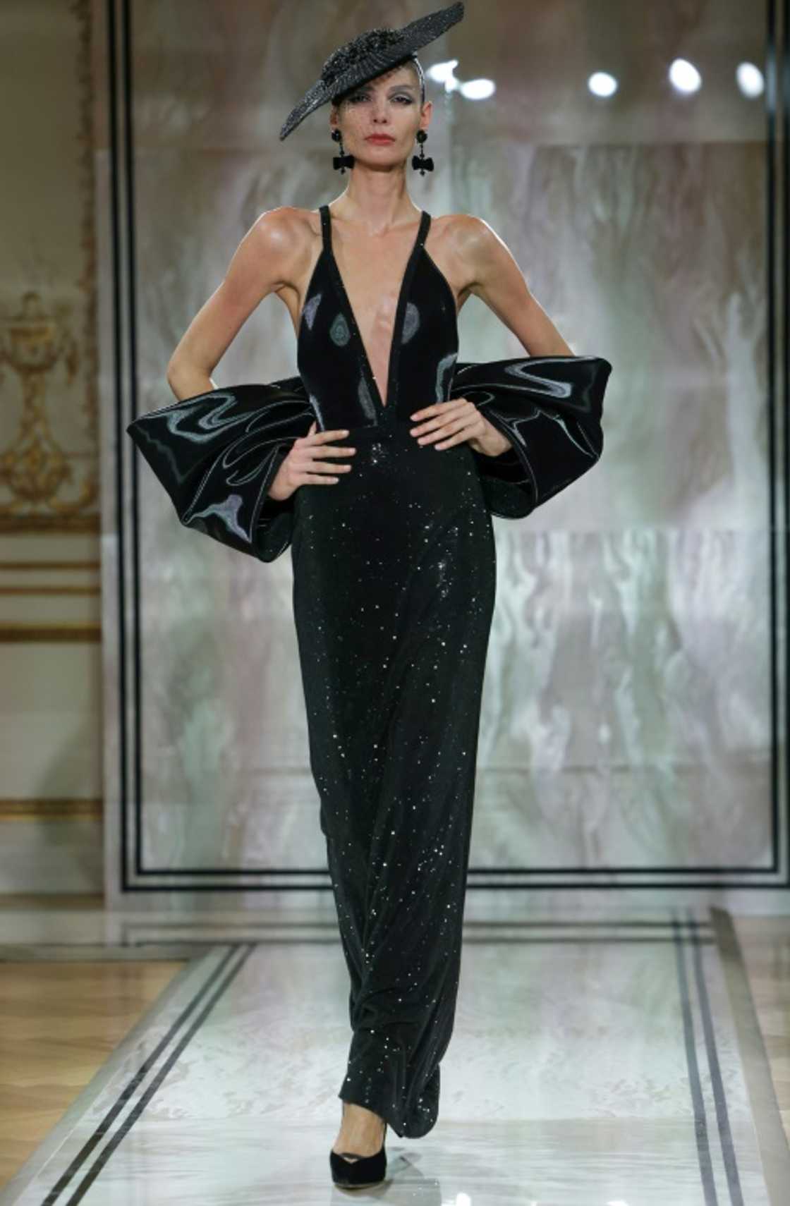 Armani, absent on doctors' orders, said he had overseen 'every aspect' of his collection Armani, absent on doctors' orders, said he had overseen 'every aspect' of his collection