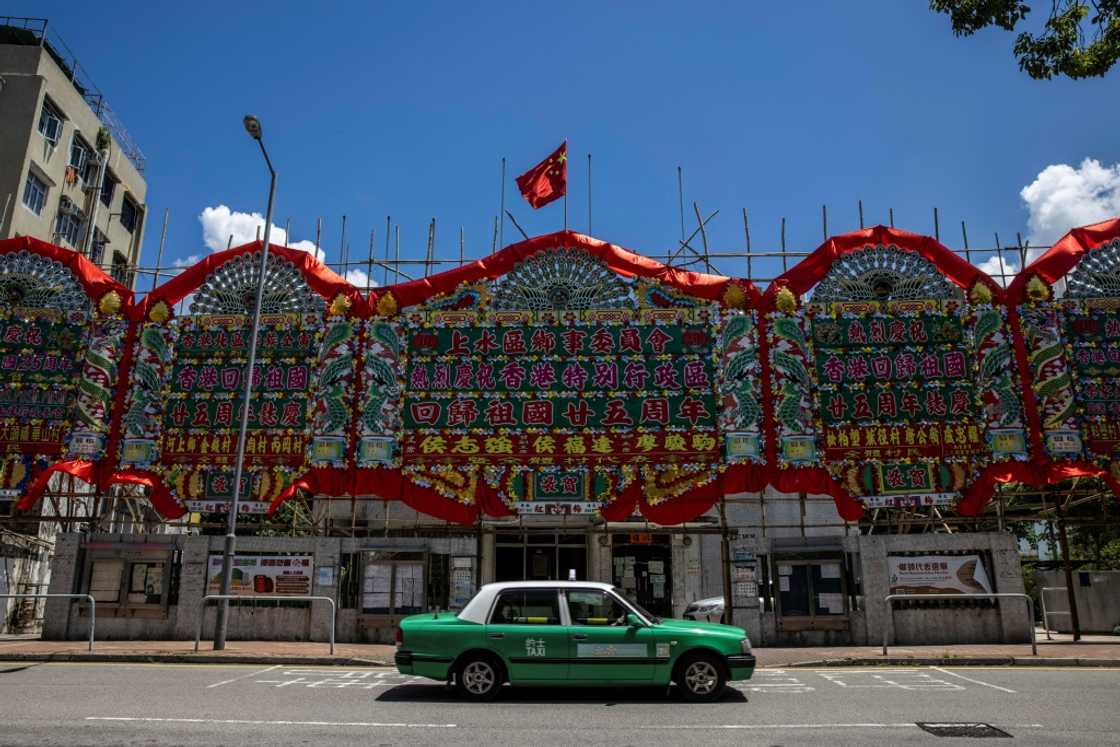 Signage in Sheung Shui, close to the mainland Chinese border, congratulates Hong Kong's incoming chief executive John Lee and celebrates the 25th anniversary of the city's handover from Britain to China