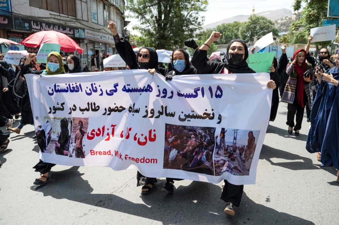 The protesters carried a banner that read 'August 15 is a black day' The protesters carried a banner that read 'August 15 is a black day'