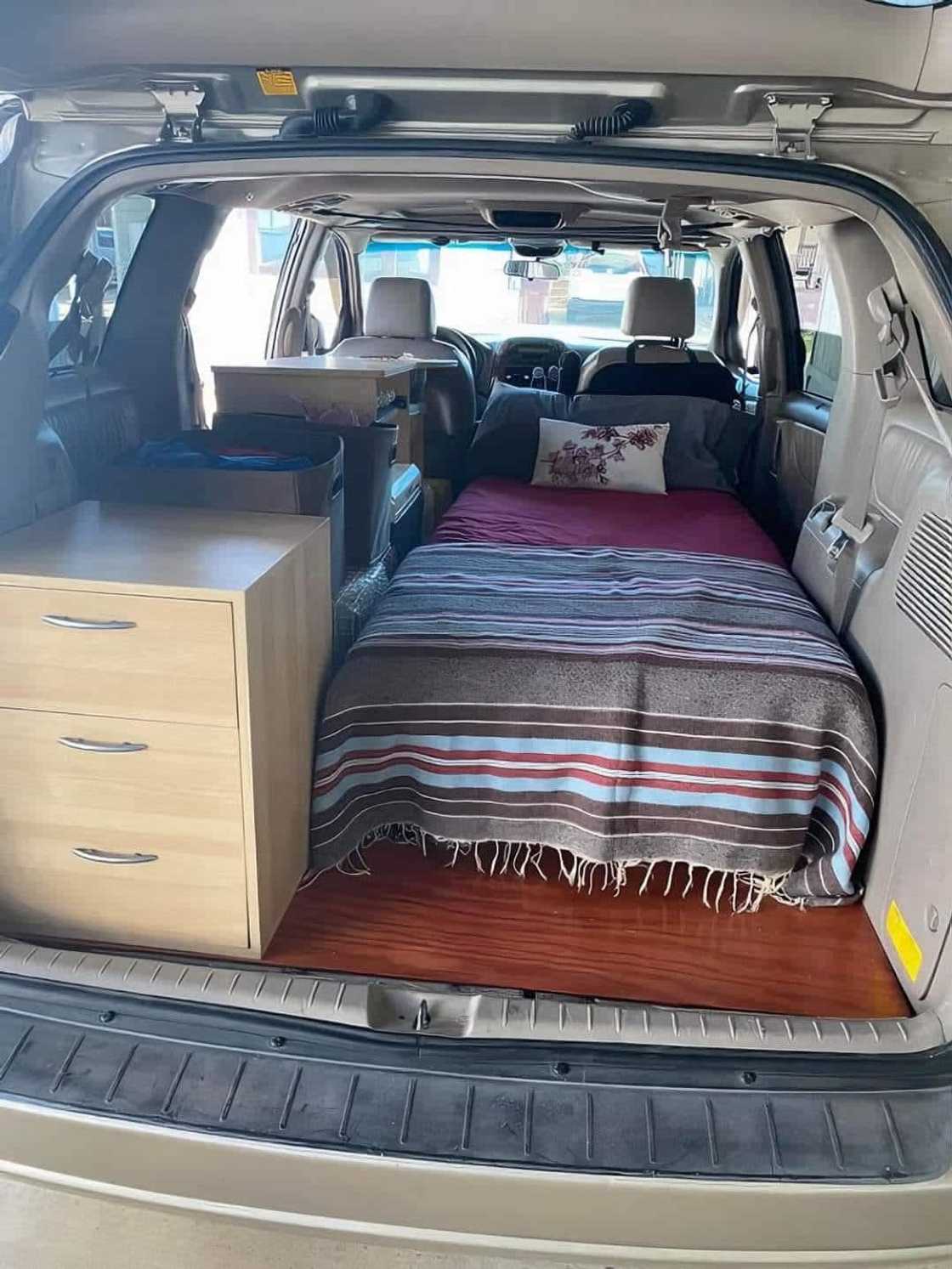 A car turned into a bedroom. A car turned into a bedroom.
